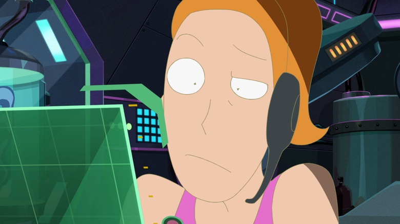 Summer wears headset at computer