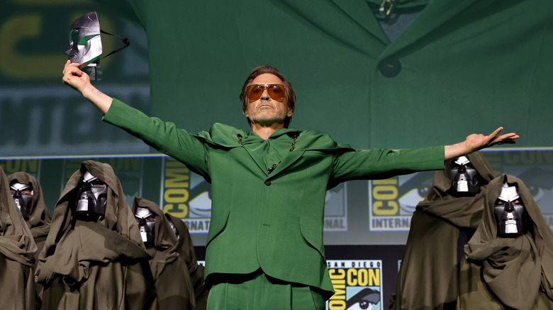 Robert Downey Jr. holding Doom mask